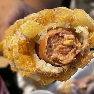 Inside of the corn dog, with hot dog inside and potato outer shell - Get this one, this is the best