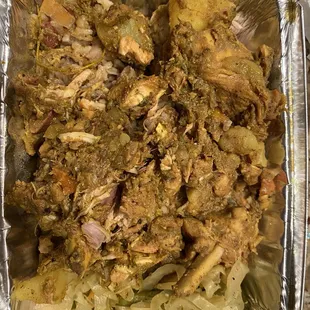 a chicken dish in a foil container