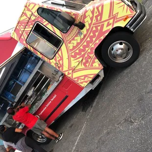 a food truck parked on the side of the road