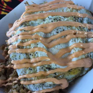 Fried rice bowl with fried egg and stellar secret sauce!