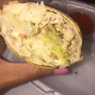Inside jerk chicken egg roll. Lots of filler, not as much meat.