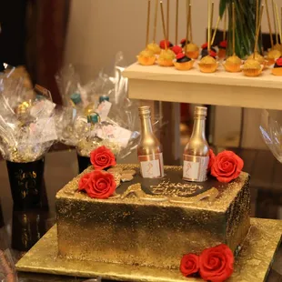 a gold cake with red roses