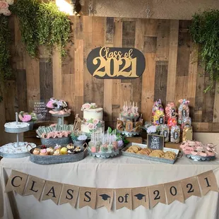 Dessert table with cake, cookies, and cupcakes from fizz