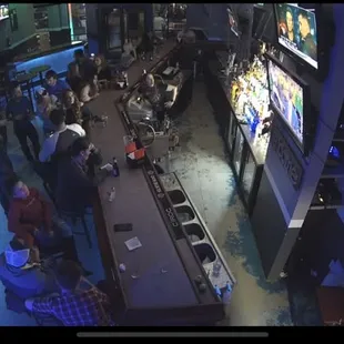 a crowd of people watching televisions