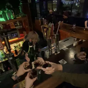 a group of people sitting at a bar