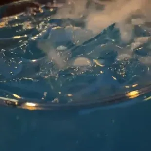 a close up of a glass of liquid