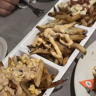 Fizzle Fries Flight with Mexican Street, Truffle, and Bacon Mac n cheese