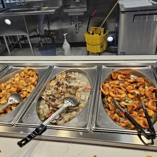 a variety of food items in a buffet