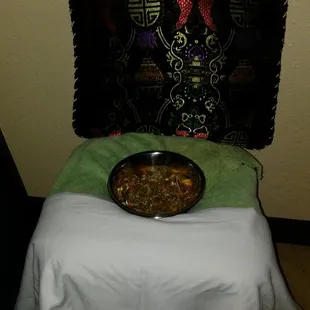 Yoni Steaming Chair with a bowl of herbs