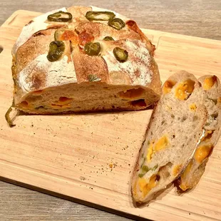 Jalapeño Cheddar Sourdough Loaf. Spicy and fresh with globs of cheese found throughout the bread.