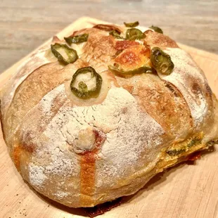 Jalapeño Cheddar Sourdough Loaf. Spicy and fresh with globs of cheese found throughout the bread.