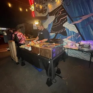 a man preparing food on a table