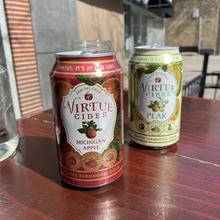 two cans of beer on a table