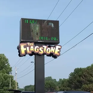 a sign for flagstone