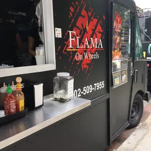 a food truck parked on the side of the road