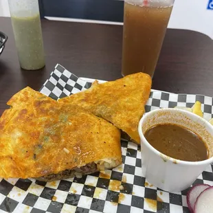 Quessabirria with consume and Tamarindo water