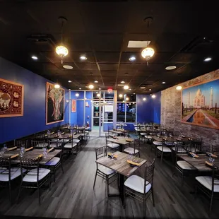 a dining area with tables and chairs