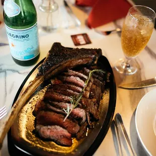 32 oz tomahawk steak cooked in a rosemary butter.