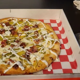 Pickle bacon ranch pizza with light speed lager beer