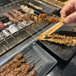 a person using a wooden skewer