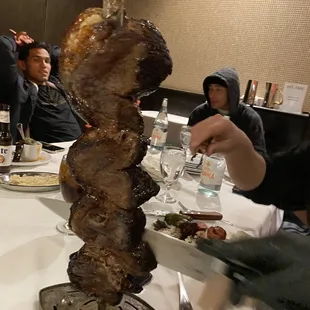 a group of people sitting around a table