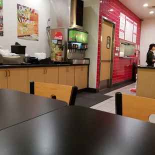 a restaurant with tables and chairs