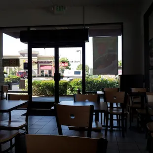an empty restaurant with tables and chairs