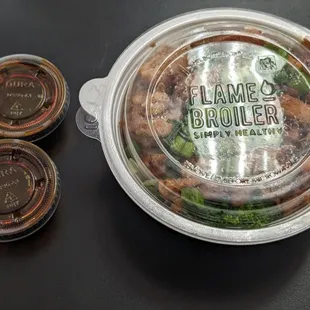 Mini Chicken Bowl with two cups of Teriyaki sauce