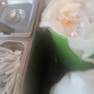 Utensils right next to a trash can. SMH