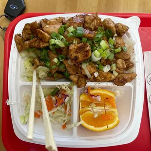 a plate of food with chopsticks