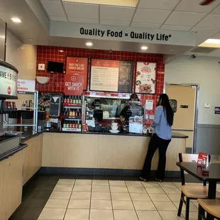 a woman standing in a restaurant