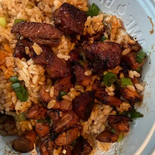 a plate of rice and meat