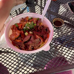 a person eating a bowl of food