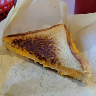 1/2 of the grilled cheese sandwich.