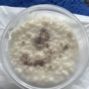 Moldy rice pudding in clear container
