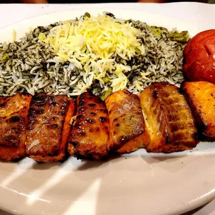 a plate of meat and rice
