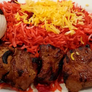 a plate of meat and rice
