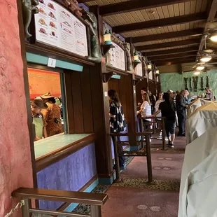 a line of people at a restaurant