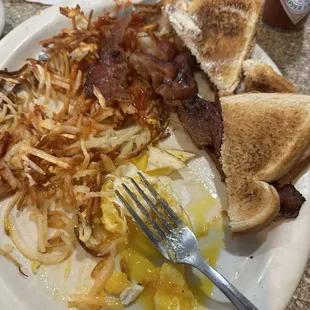Eggs, bacon, hash, burger meat and toast for like $13