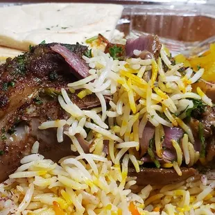 Lamb Shanks, Yellow Rice, Naan, and Greek Salad