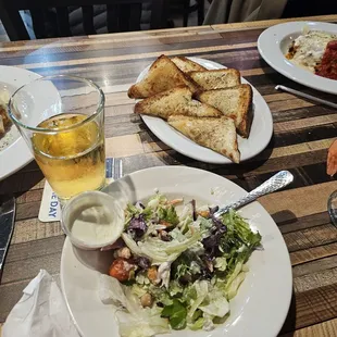 Cesar salad garlic cheese bread and pineapple  beer