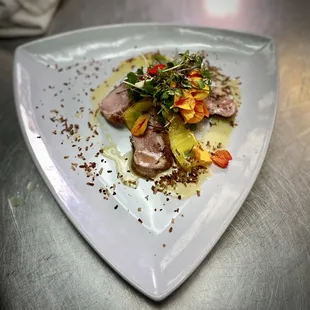 Honey glazed duck breast burnt coconut Cahaba a mesclun salad mix Sous vide and torched pineapple