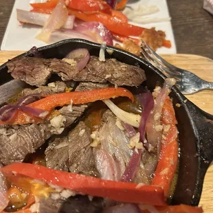Special fajitas soaked in some 'juice'. No sizzle and no flavors or cooked veggies. No bueno