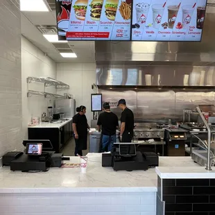 two men standing at a counter