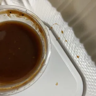 Chutney sauce with the first piece of hair that was found after dipping in veggie samosa.