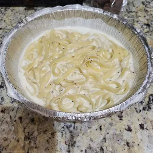 Fettuccine Alfredo.  Usually almost equally as full as the spaghetti.