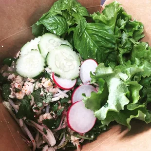 a salad in a paper box