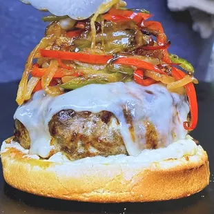 Flaming Bird Burger 
Roasted Garlic Aioli
Provolone cheese 
Lettuce 
Sautéed onions and peppers