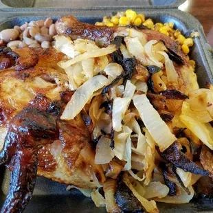 a close up of a meal in a styrofoam container