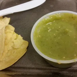 a bowl of guacamole and tortilla